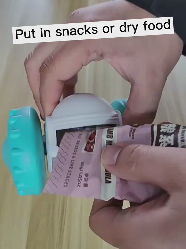 Video showing how to insert treats into the automatic treat dispenser robot toy.