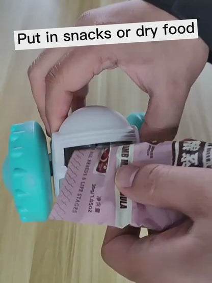 Video showing how to insert treats into the automatic treat dispenser robot toy.